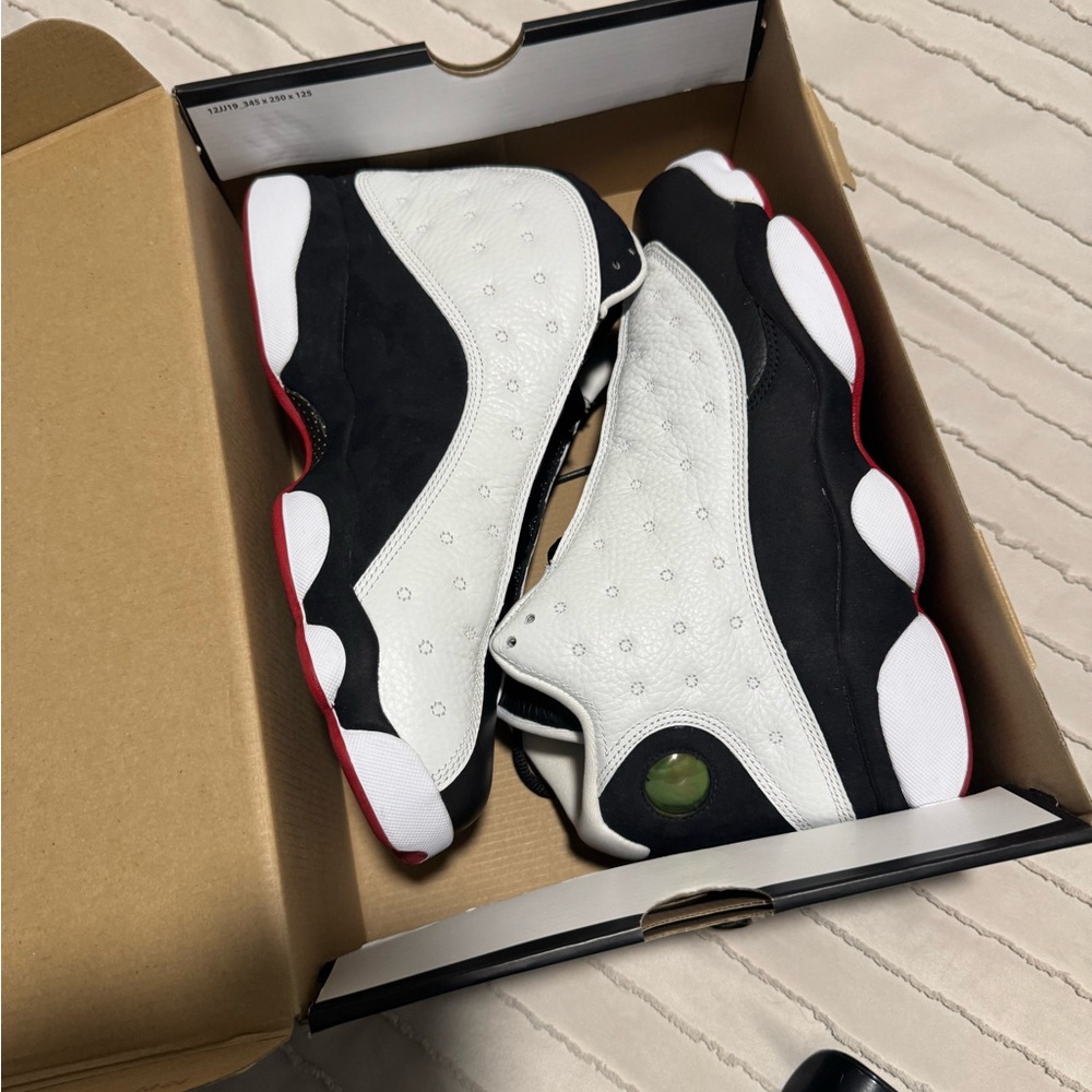 White and Black Sneakers with Red Accents